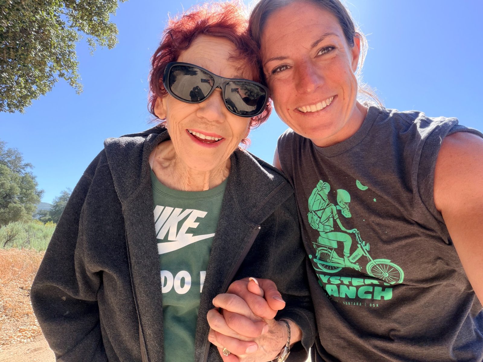 Coach with an older woman outdoors